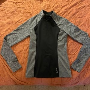 Reebok pullover with sideways neck zip